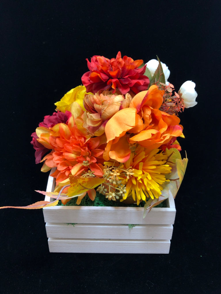 WHITE SLOTED PLANTER W/ FALL FLORAL ARRANGEMENT.