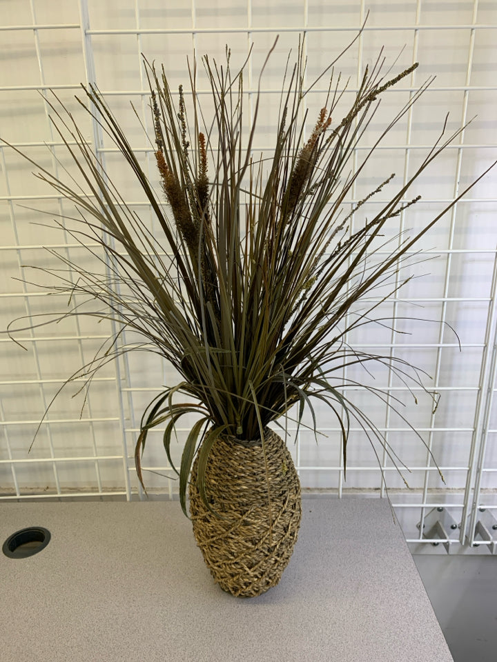 FAUX GRASS IN TWINE PLANTER.