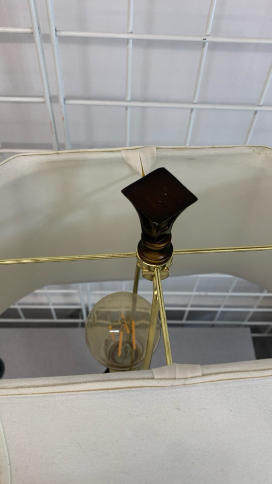 WOODEN TABLE LAMP W/CREAM SHADE.