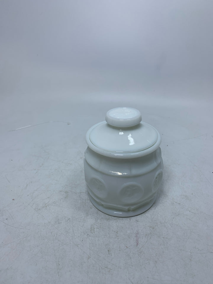 VTG SMALL MILK GLASS CANISTER W/ EAGLE COIN DETAILS.