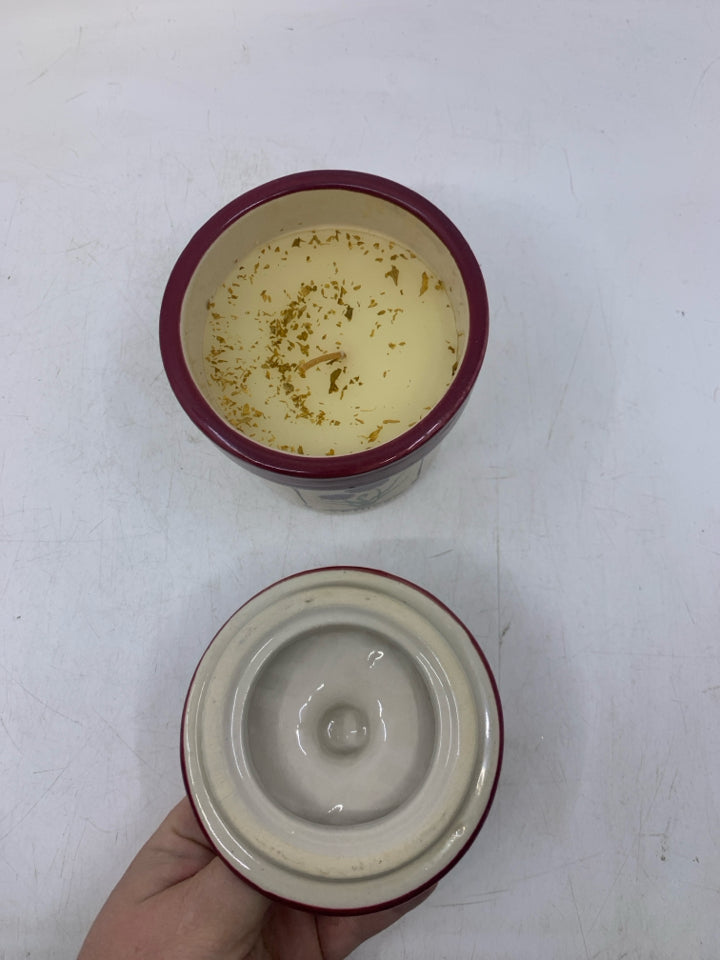 CHIVE CANISTER W/ CANDLE INSIDE.