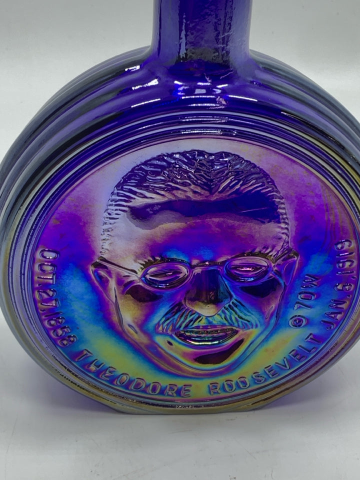 VTG PURPLE IRIDESCENT GLASS ROOSEVELT EMPTY BOTTLE.