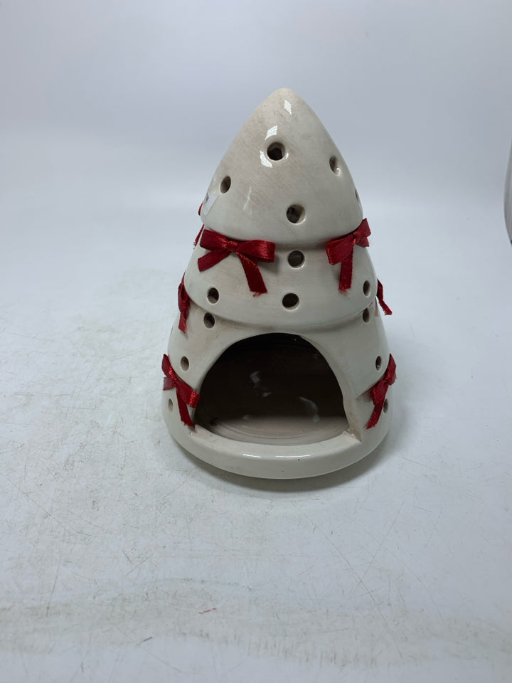 CREAM PIERCED CHRISTMAS TREE W/ RED BOWS TEALIGHT HOLDER.