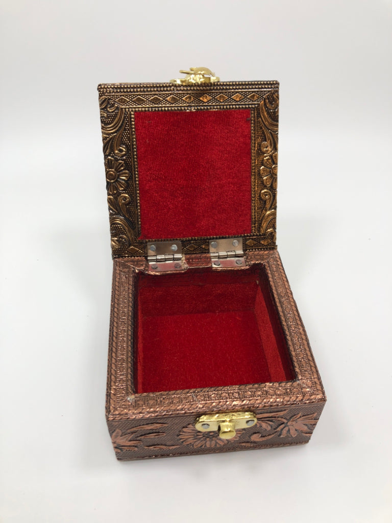 GOLD ELEPHANT BOX W/RED FABRIC LINING.