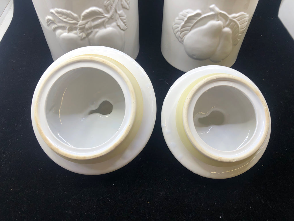 2 WHITE EMBOSSED APPLE CANISTERS.