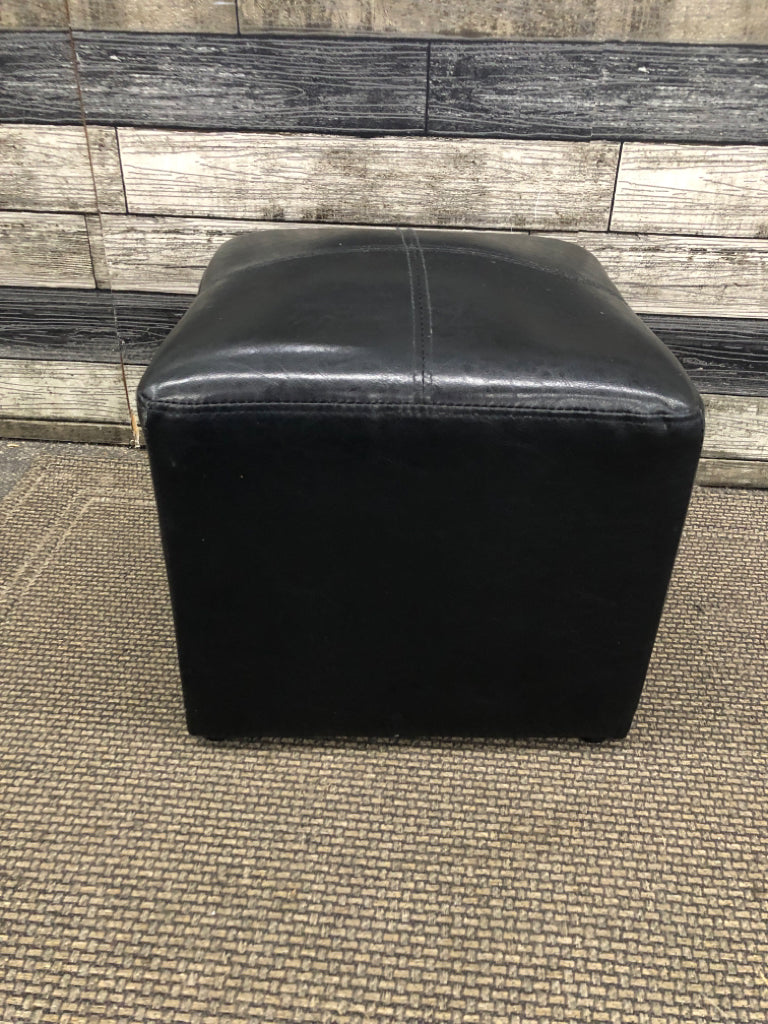 SM BLACK FAUX LEATHER CUBE OTTOMAN.