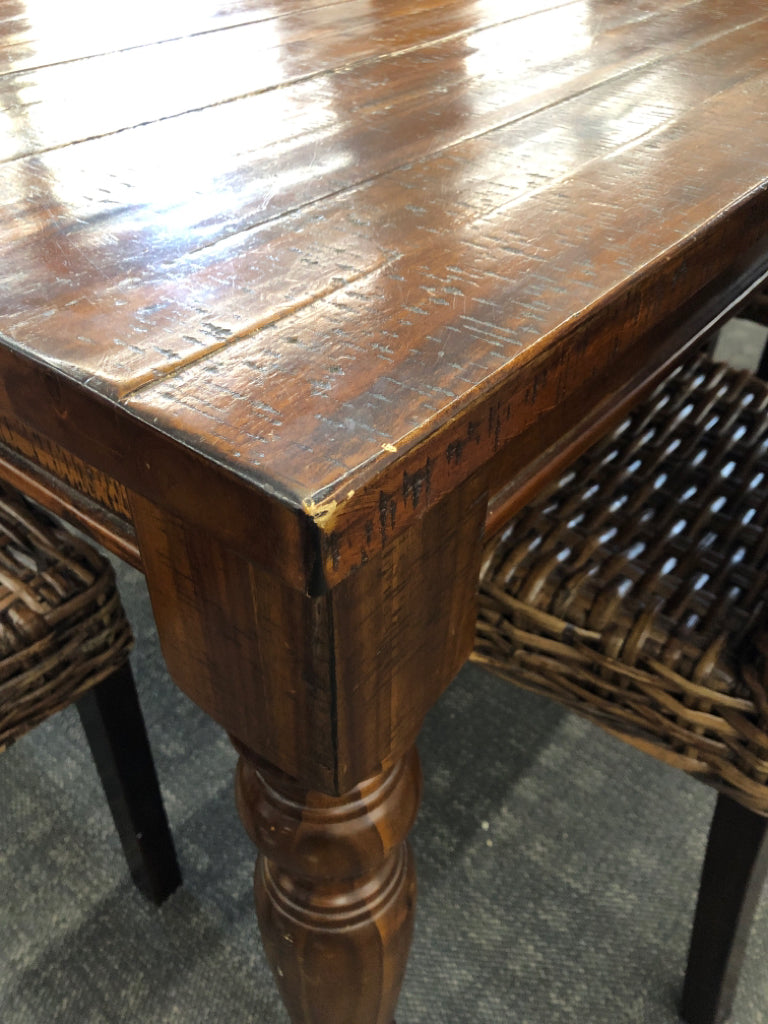 DARK WOOD STRESSED WOOD PATTERN TABLE W 6 WICKER WOVEN CHAIRS.
