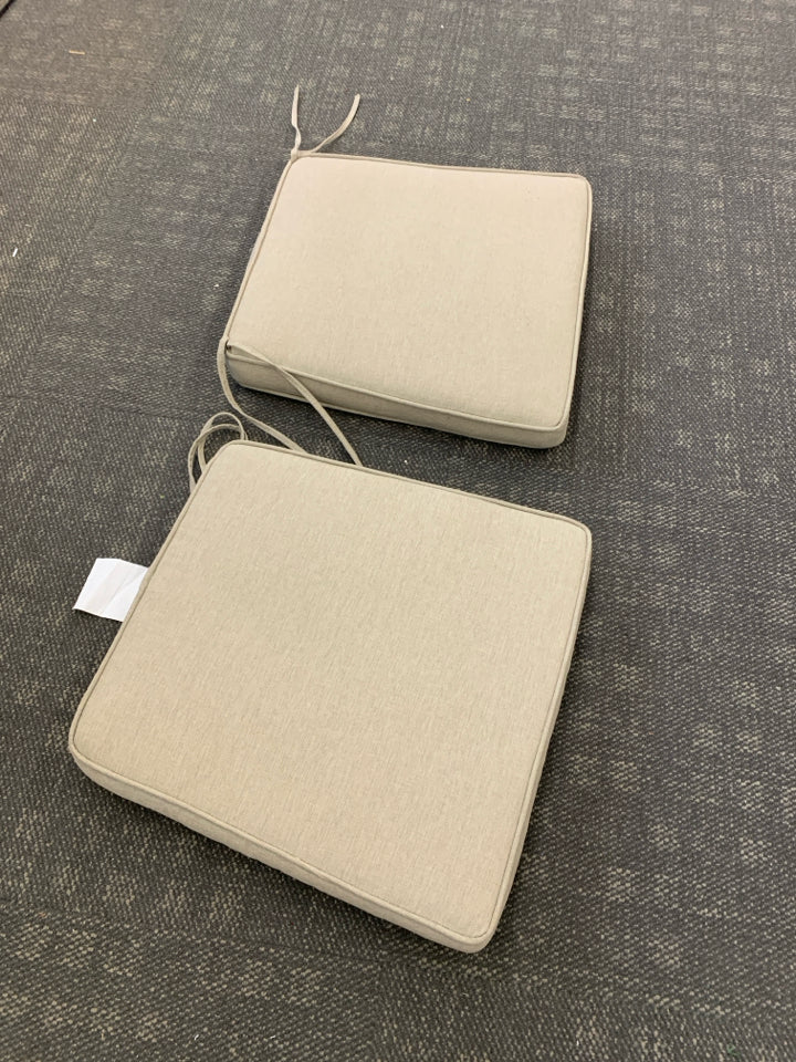 2 TAN CHAIR CUSHIONS.