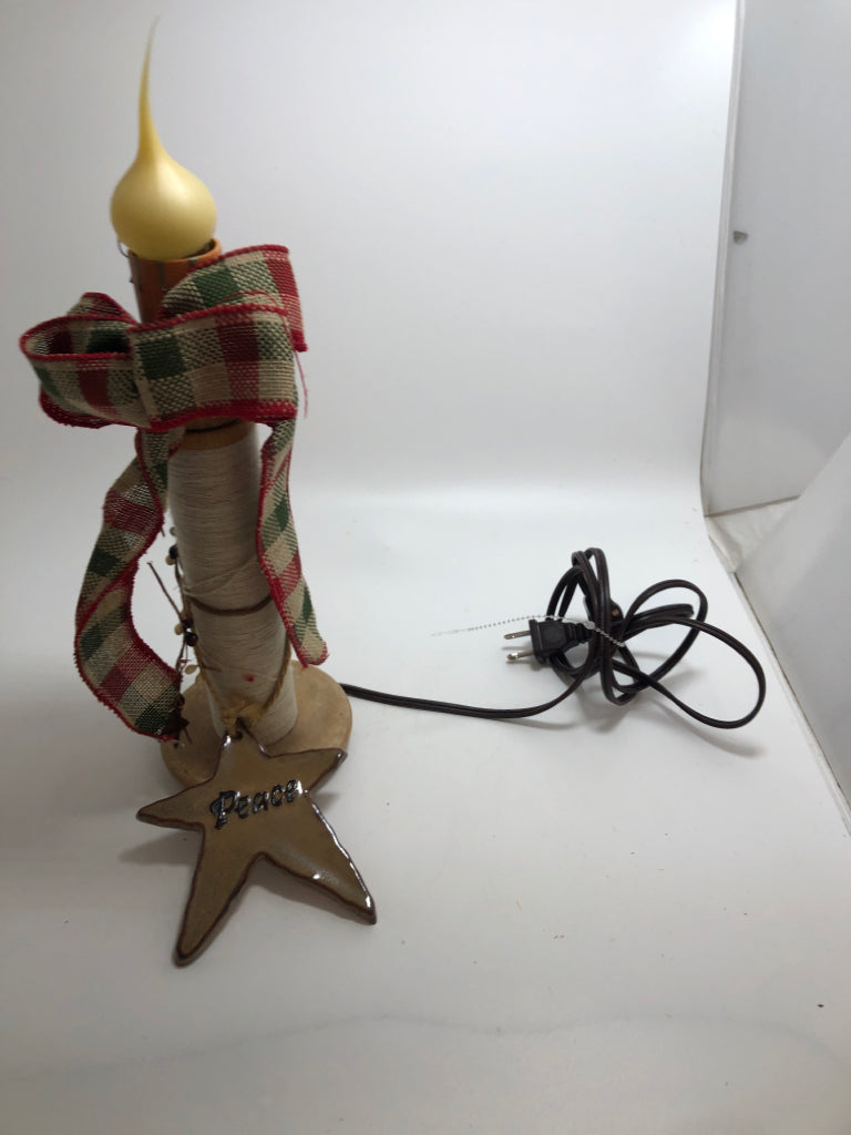 PRIMITIVE CHRISTMAS LIGHT UP CANDLE W/GREEN AND RED RIBBON.