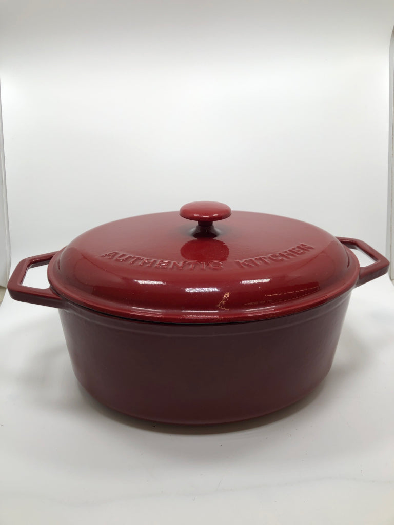 RED OVAL CAST IRON DUTCH OVEN.