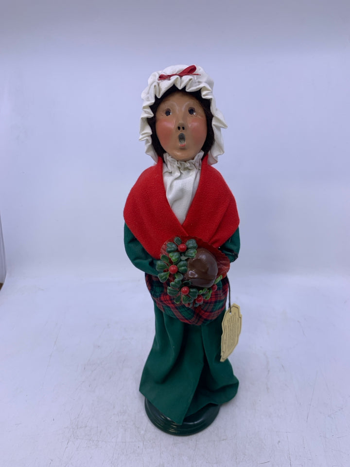 1993 BYERS' CHOICE WOMAN CAROLER WITH FLOWERS.