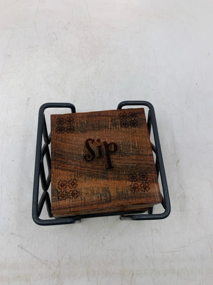 4 CARVED WOOD COASTERS IN STAND