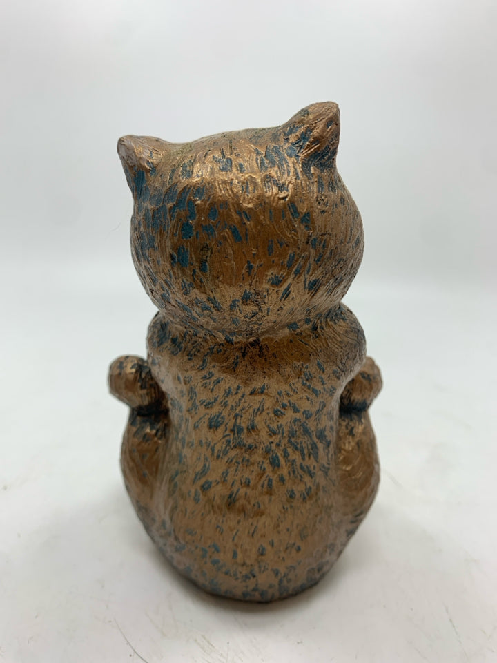 BRONZE PAINTED CHESHIRE CAT FIGURE.