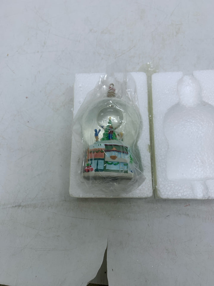 IN BOX TRIMMING THE TREES SNOW GLOBE HALLMARK ORNAMENT.