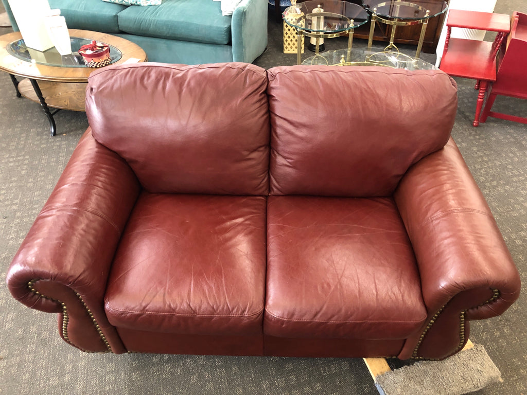 DARK BROWN STUDDED LOVE SEAT.