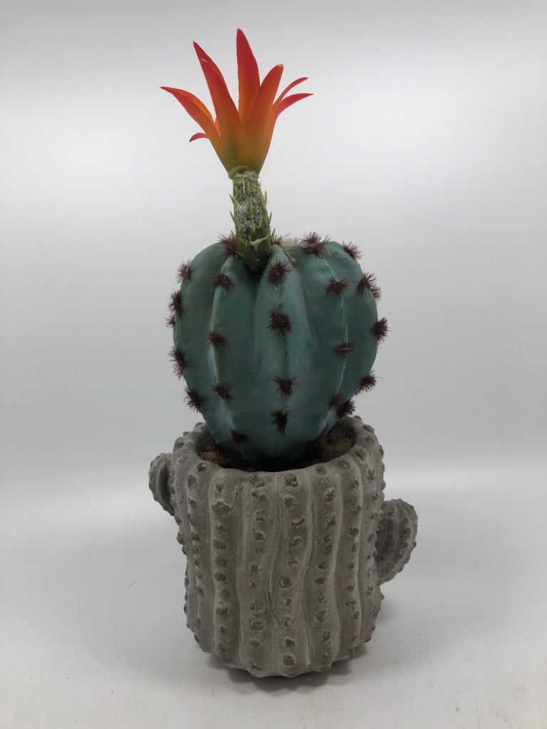 FAUX BLUE CACTUS IN CERAMIC CACTUS POT.