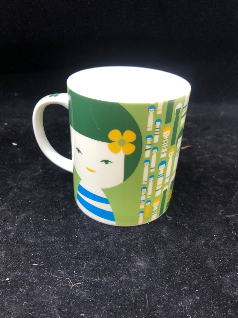 GREEN LITTLE GIRLS FACE MUG.