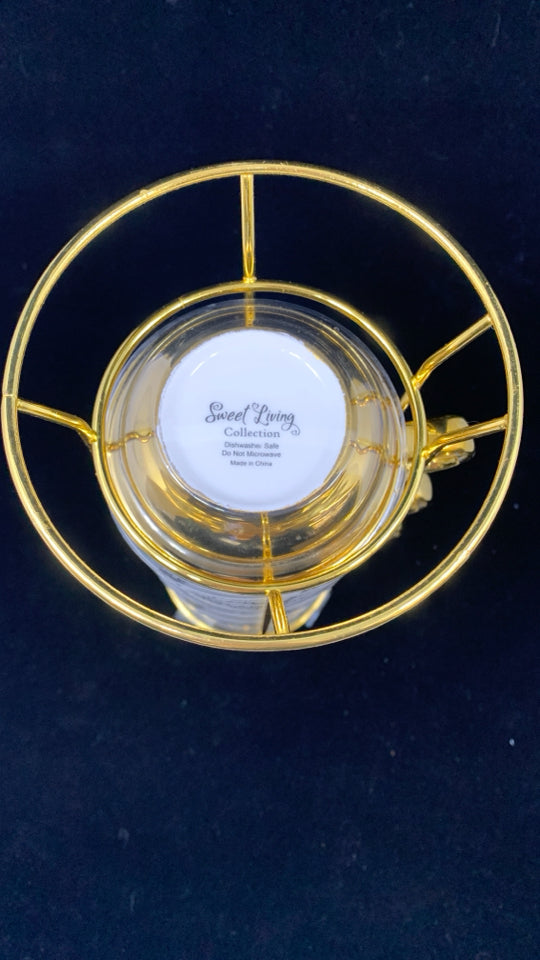 4 GOLD RIMMED I CAN DO ALL THINGS MUGS IN STAND.