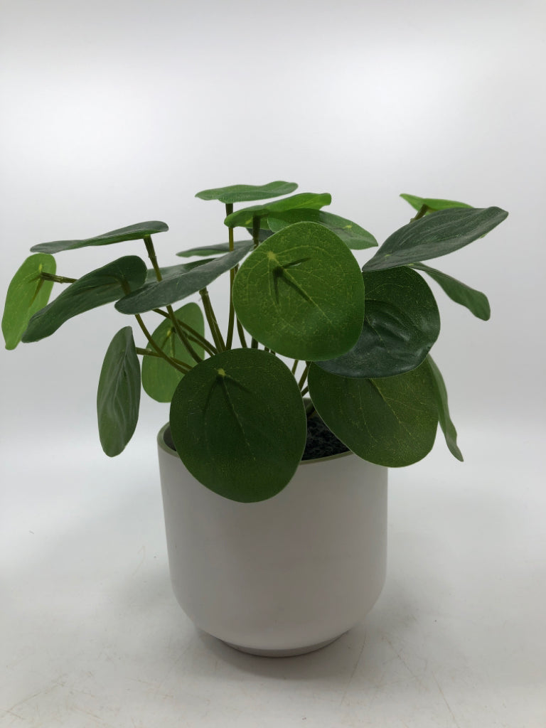 FAUX PLANT IN WHITE PLANTER.