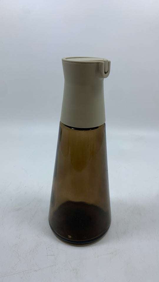 BROWN GLASS BOTTLE W/PLASTIC POUR SPOUT.