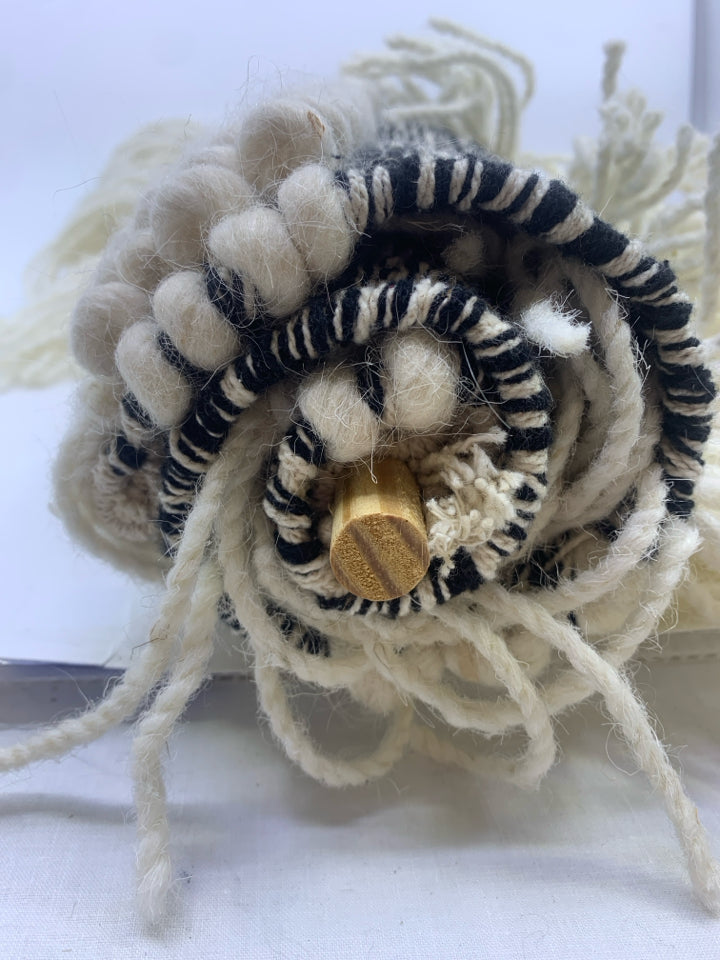 BLACK AND WHITE SHAG WALL HANGING.