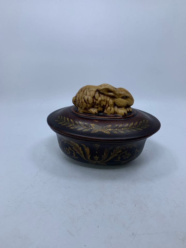 OVAL DARK BROWN W/ SCROLL LAYING RABBIT ON LID.