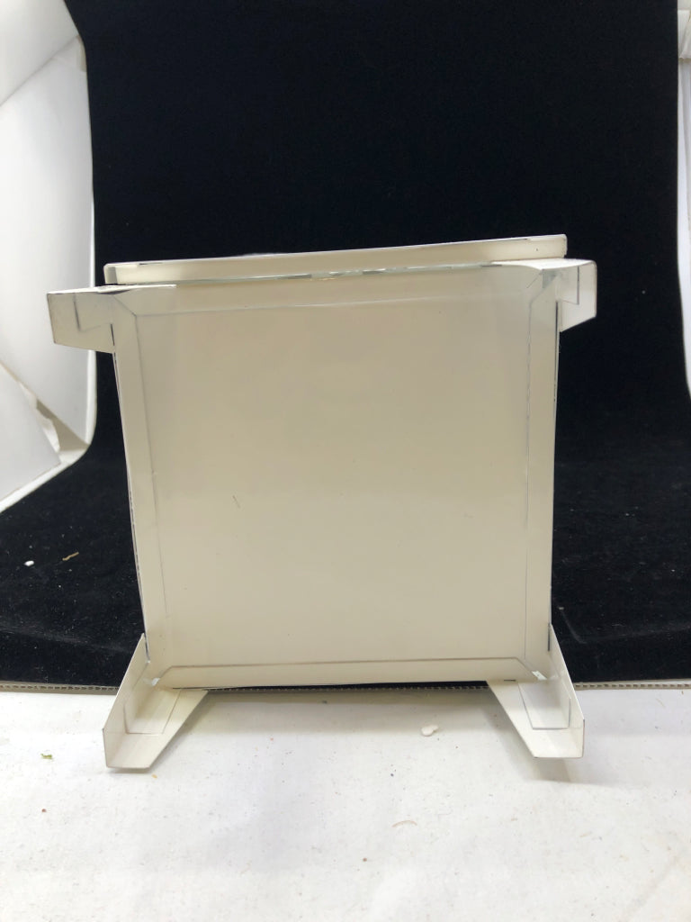 FOOTED WHITE PIERCED METAL LANTERN.