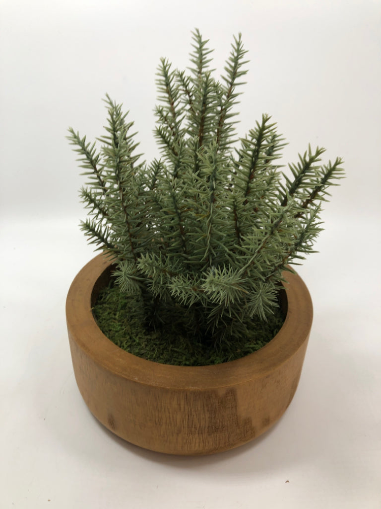 FAUX GREENERY IN WOOD POT.