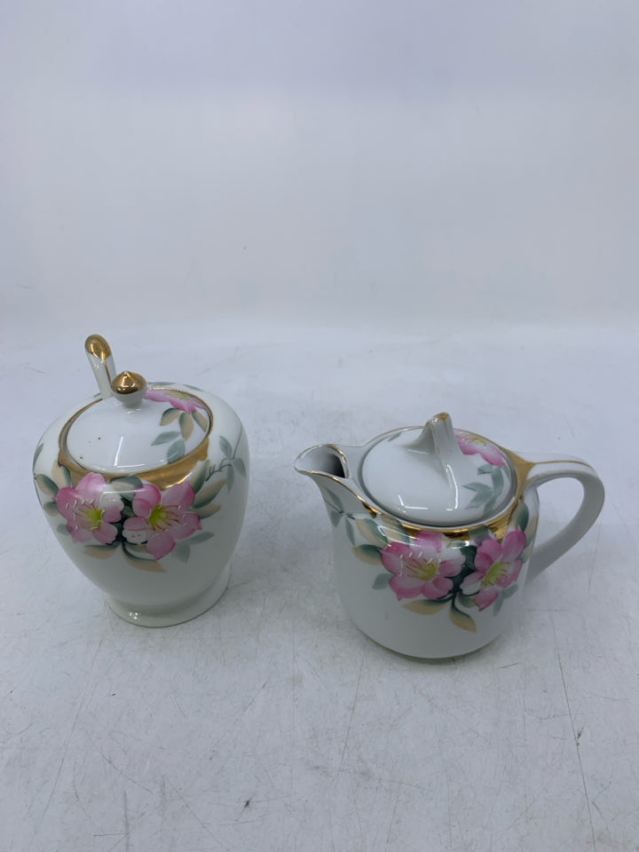 WHITE W/ PINK FLOWERS GOLD DETAILS.