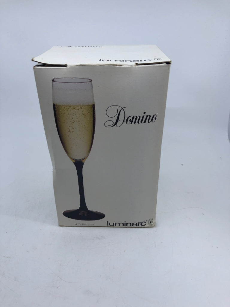 4 BLACK STEM CHAMPAGNE FLUTES W/BOX.