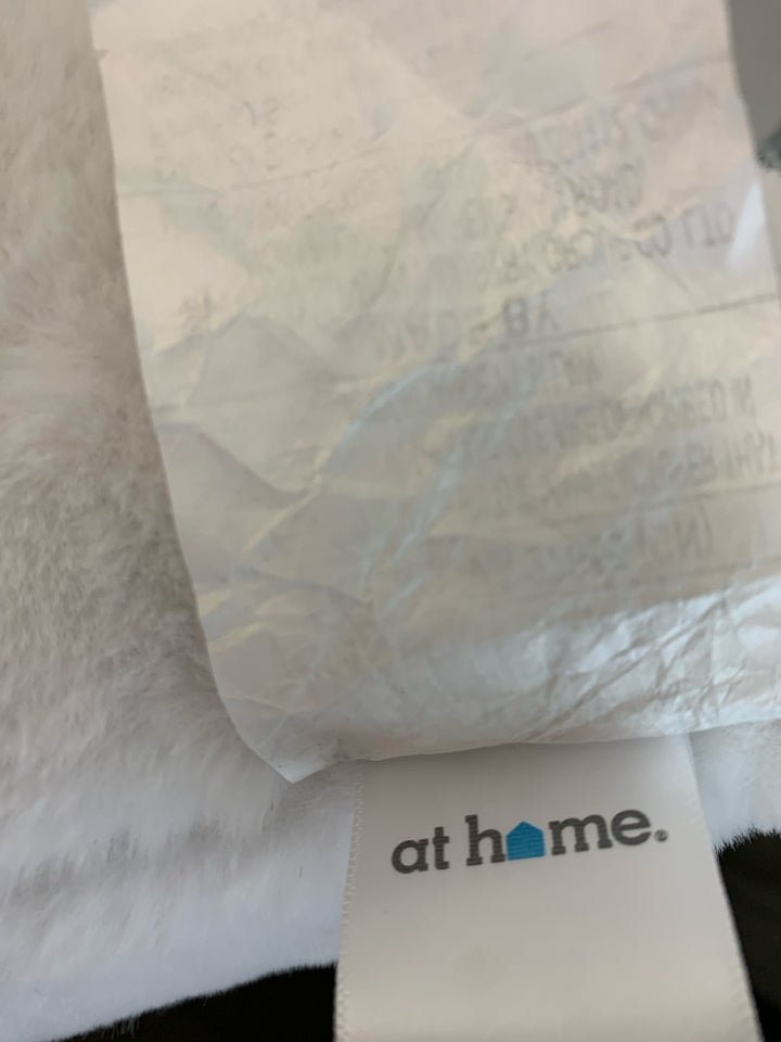 WHITE RECTANGLE FUZZY PILLOW.