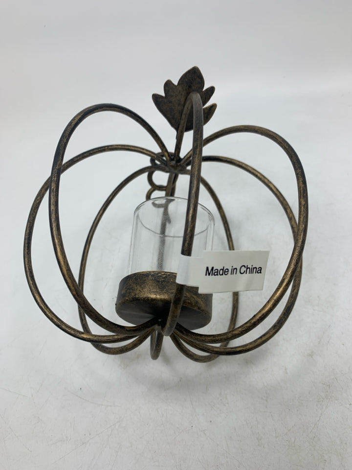 METAL PUMPKIN VOTIVE HOLDER.