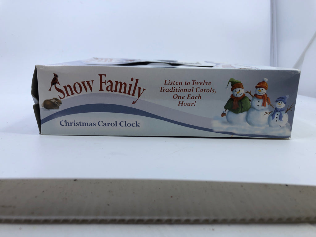 NIB SNOW FAMILY CHRISTMAS CAROL CLOCK.