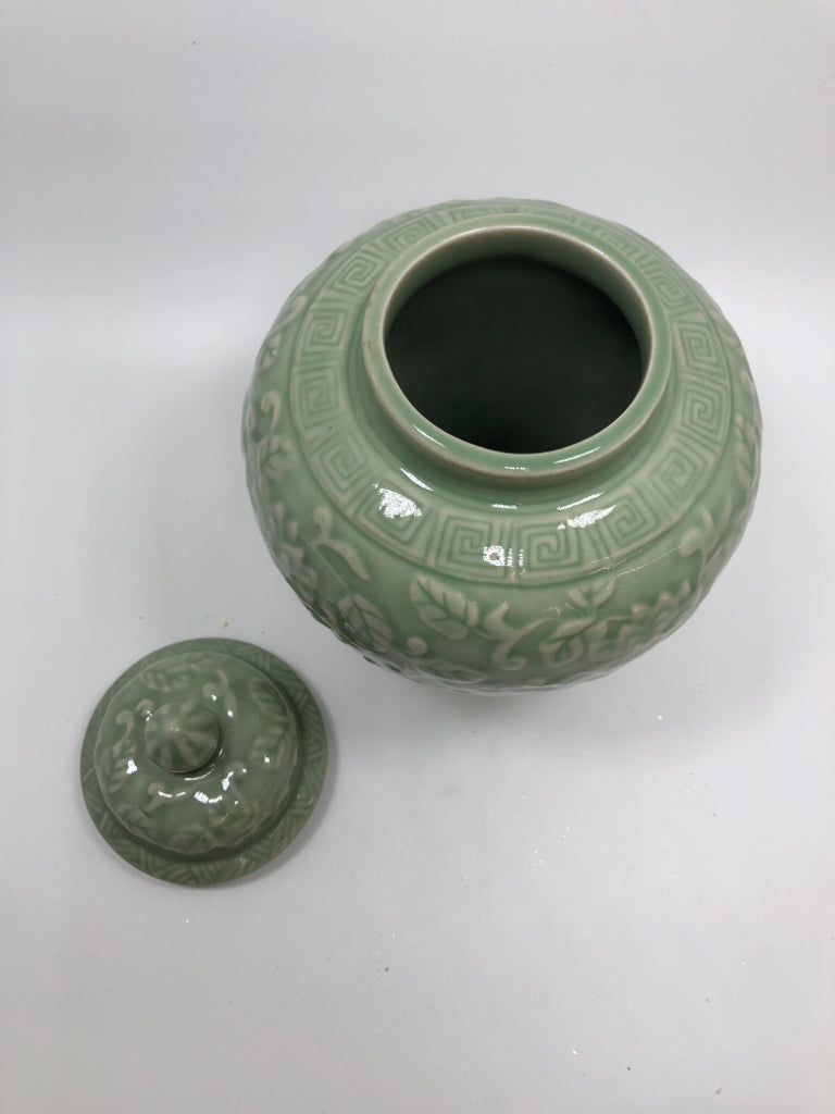 GREEN CERAMIC GINGER JAR W/EMBOSSED FLOWERS.