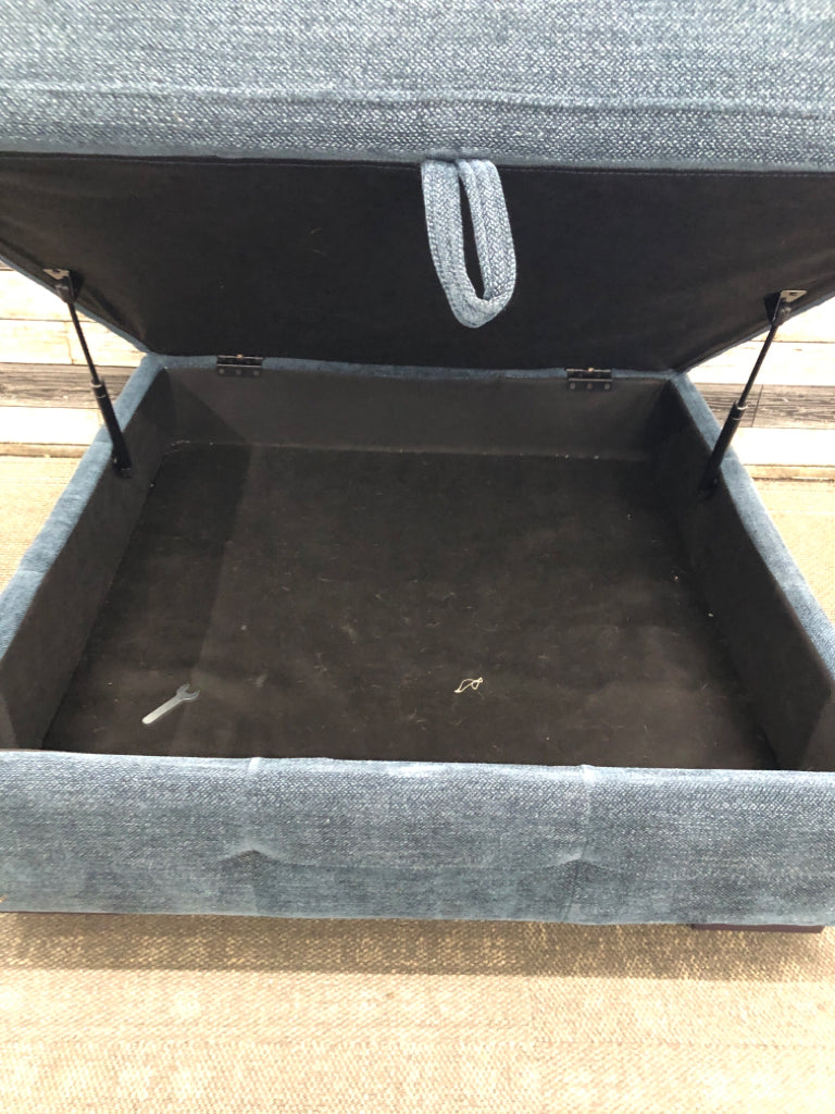 BLUE FABRIC STORAGE OTTOMAN.