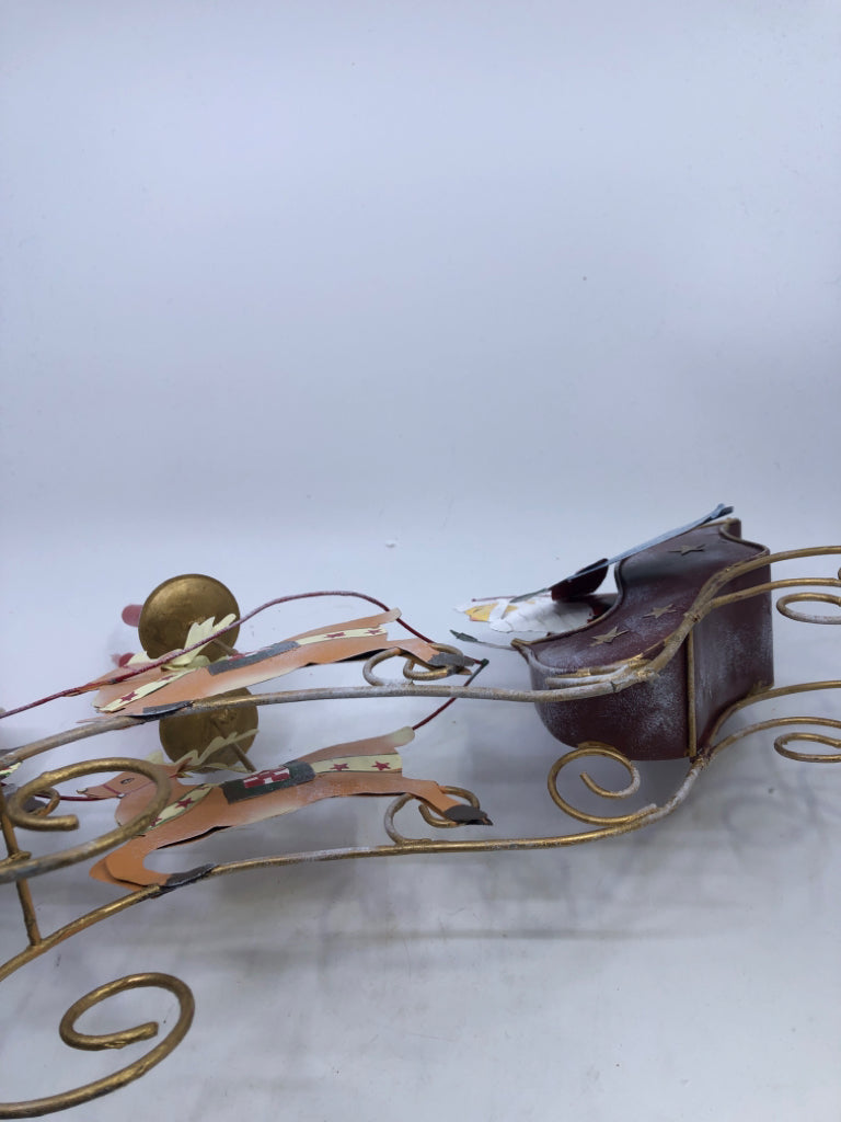 METAL SANTA IN SLEIGH CANDLE HOLDER.