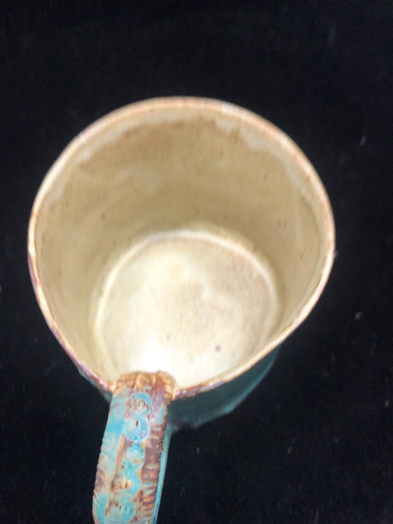 BLUE POTTERY MUG W/EMBOSSED HANDLE.