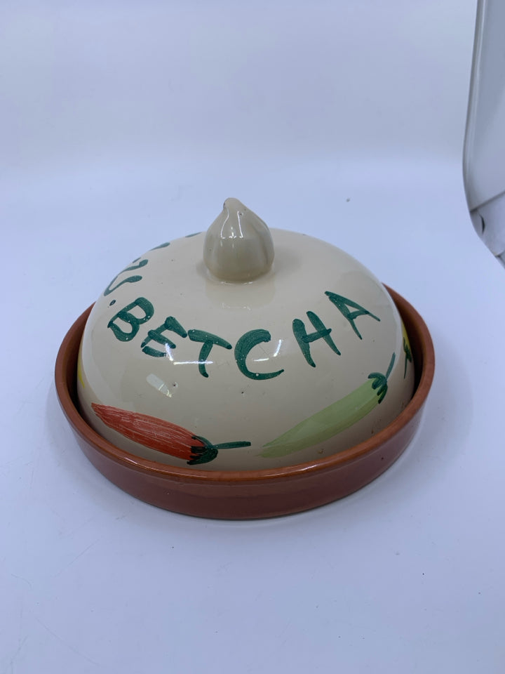 TERRA COTTA TORTILLA WARMER W/ PEPPERS ON IT.