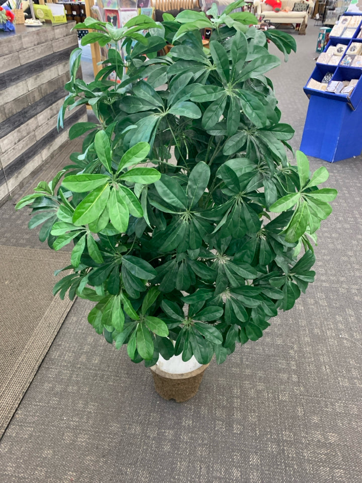 TALL FAUX PLANT IN CEMENT POT.