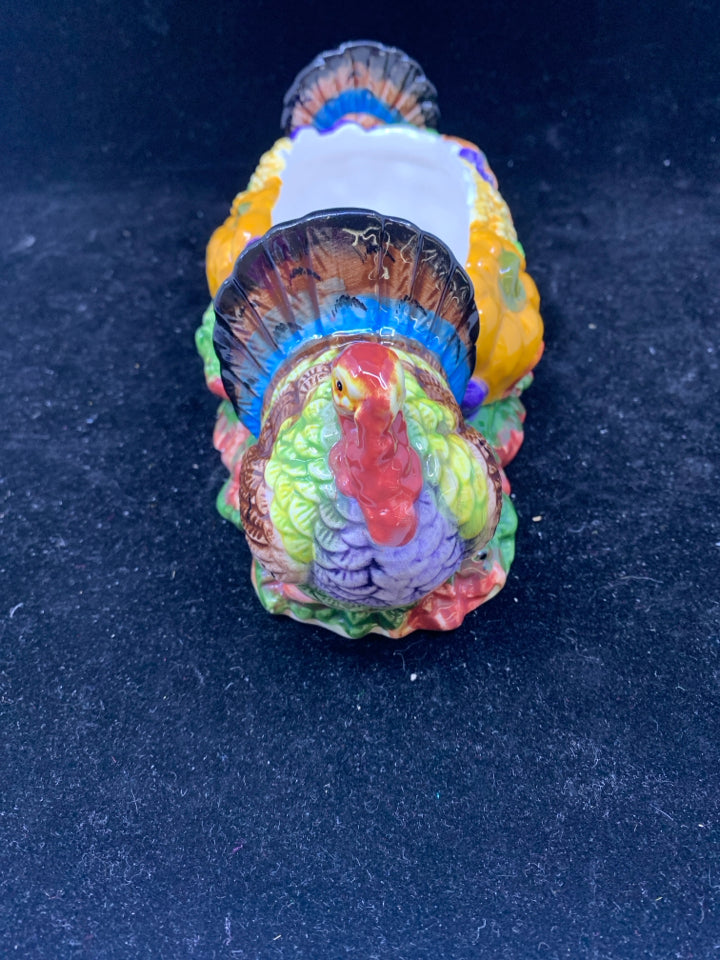 COLORFUL THANKSGIVING DISH W TURKEYS ON END.