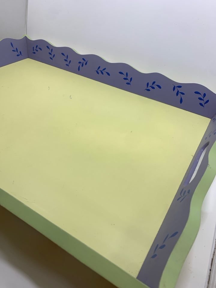 YELLOW WOOD TRAY W/BLUE PAINTED LEAVES AND WAVY EDGE.