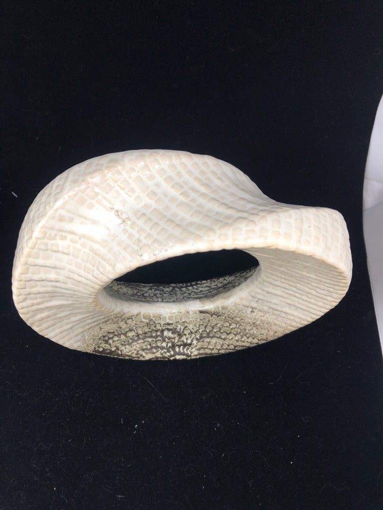 ABSTRACT CIRCULAR CUTOUT SCULPTURE CREAM AND BROWN.