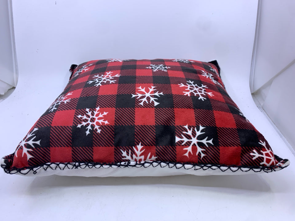 RED BUFFALO PLAID ACCENT PILLOW WITH SNOWFLAKES.