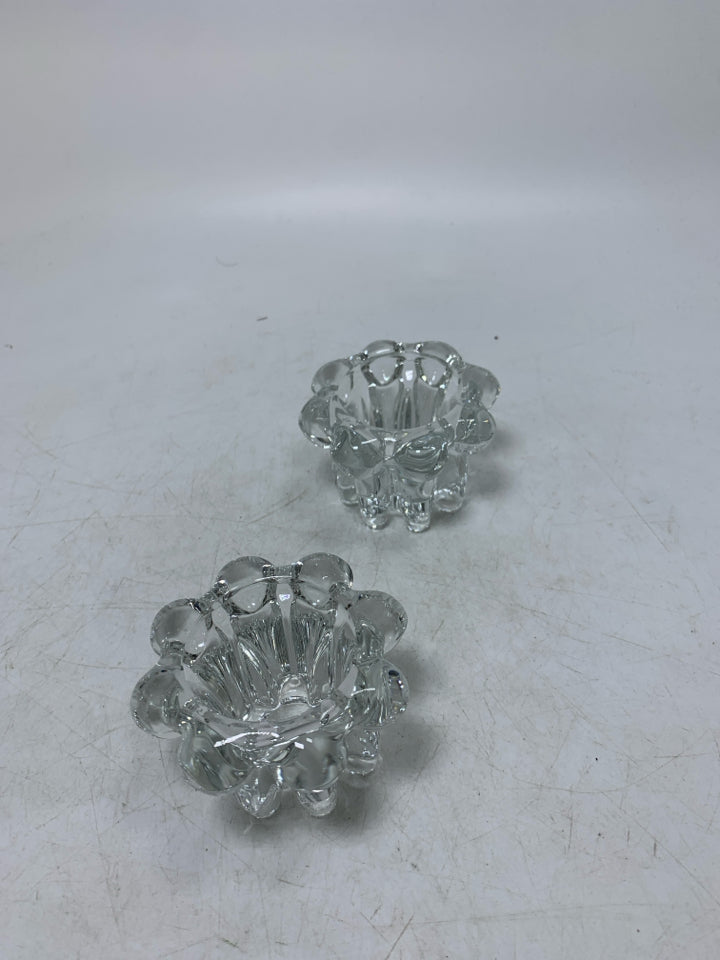 2 CLEAR GLASS TEA LIGHT HOLDERS W/ ROUNDED EDGES.