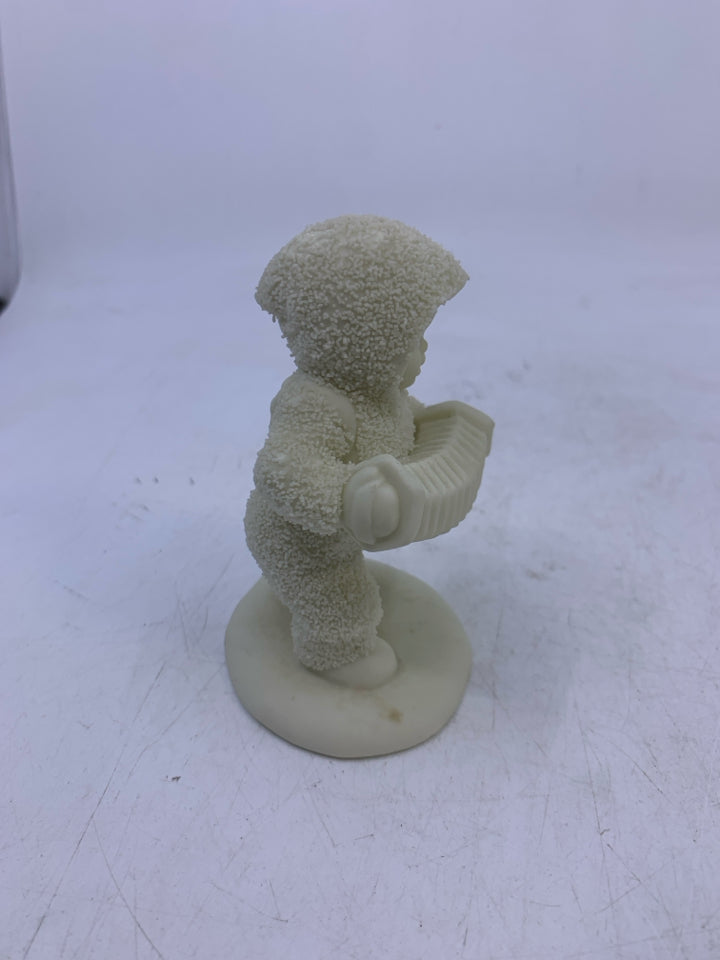 SNOW BABY HOLDING ACCORDION WALKING.