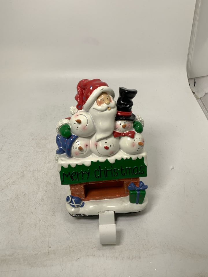 RESIN CHIMNEY W/ SANTA & SNOWMEN STOCKING HANGER.