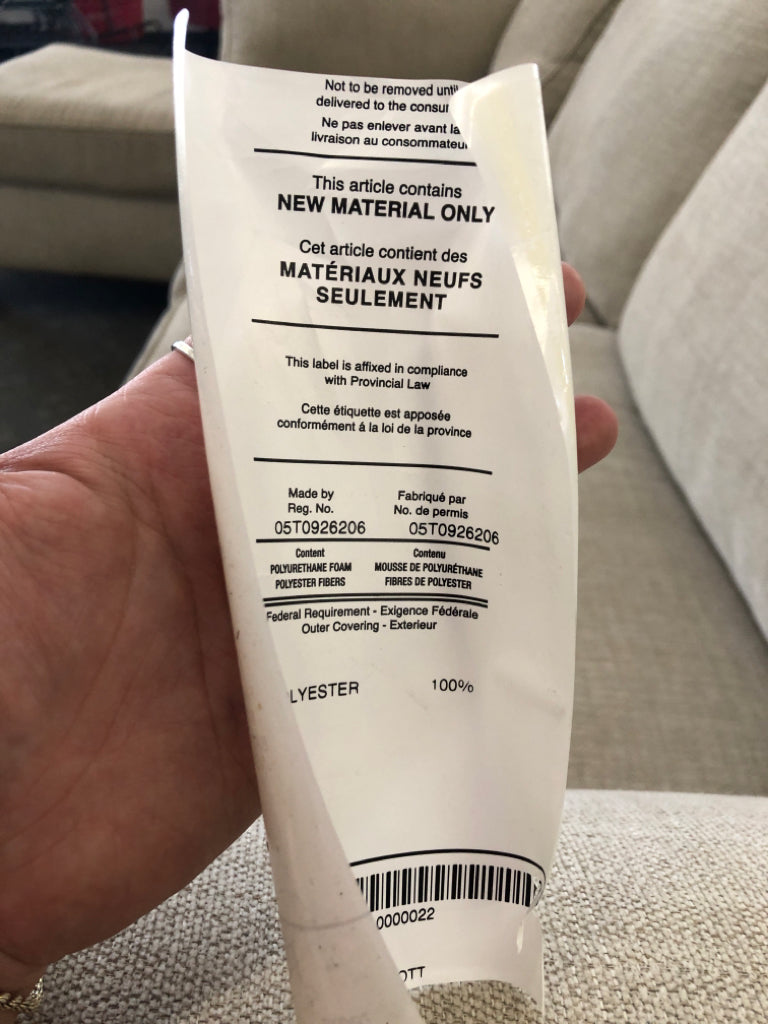 L-SHAPED CREAM COUCH.