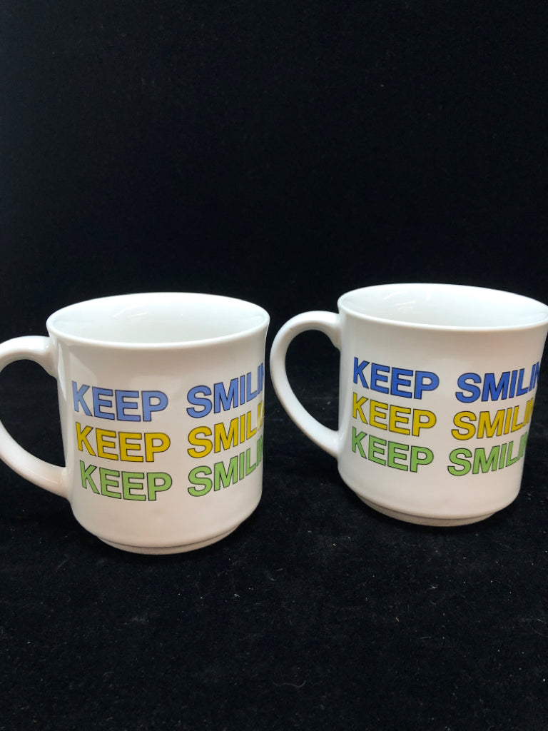 2 'KEEP SMILING' SANDRA BOYNTON MUGS.