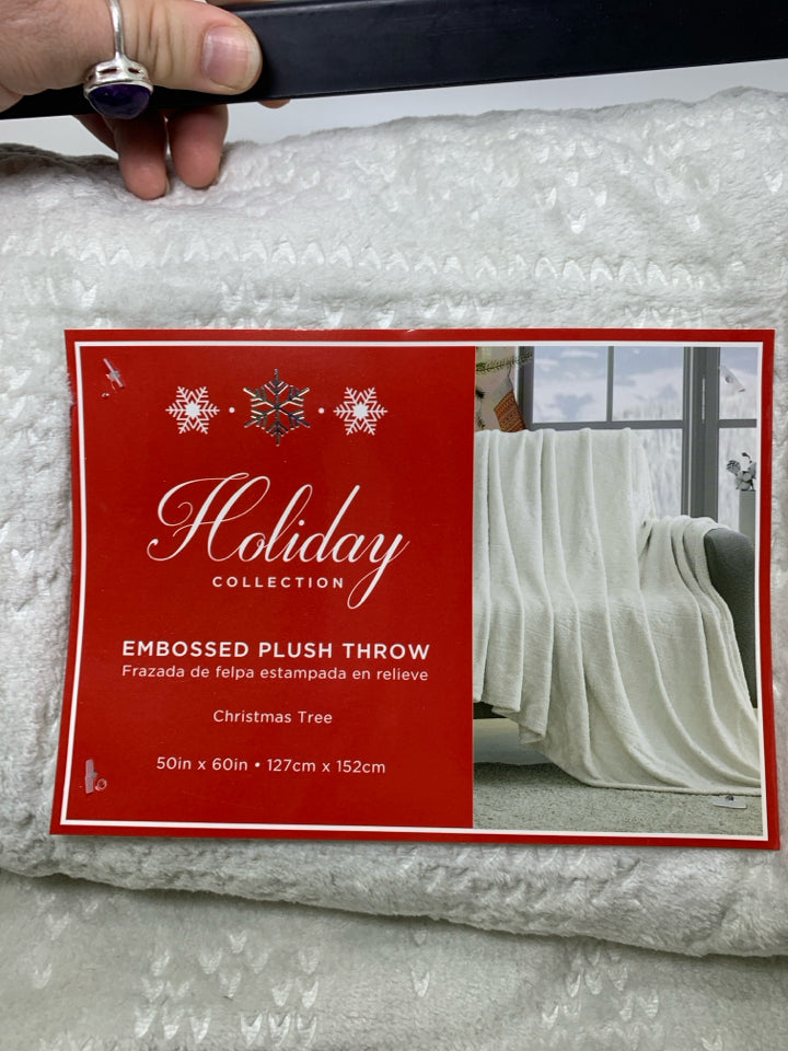 NIP IVORY EMBOSSED CHRISTMAS TREES THROW.