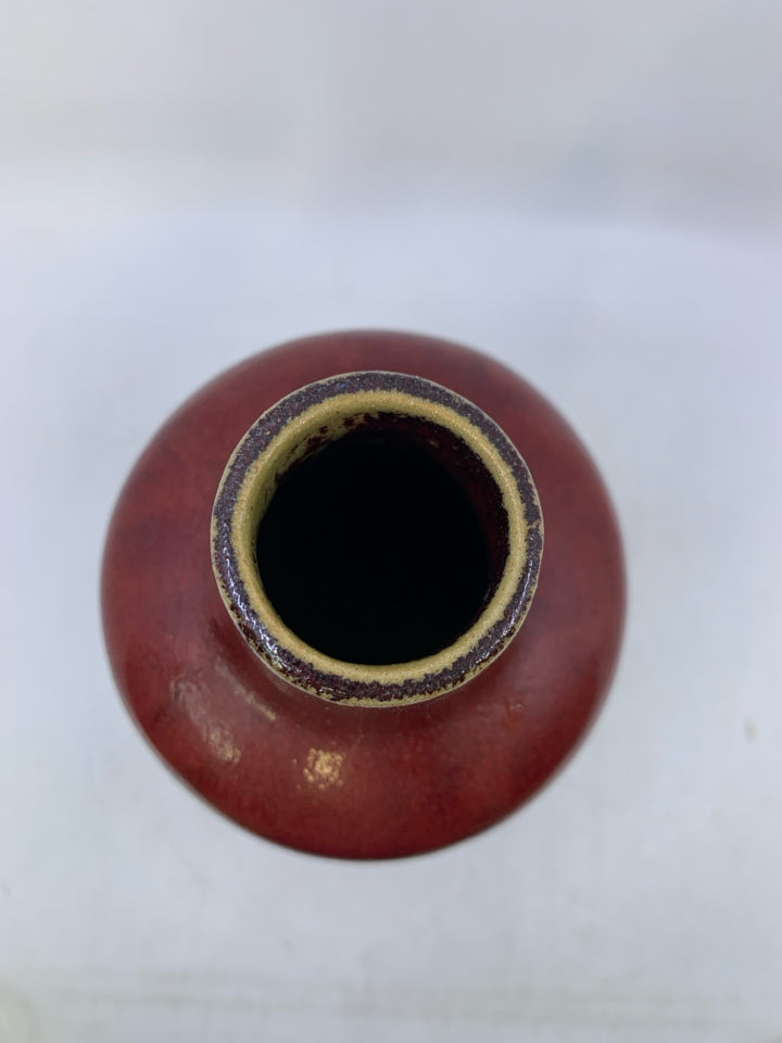 HEAVY DARK RED VASE W/ EMBOSSED DIAMOND PATTERN.